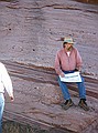 Emmett Evanoff describing the Fountain formation at Stop #1 of field trip (3/15/2003, 9:30 a.m.).  The Fountain a mixture of conglomerates with dark red arkosic sandstone layers.  It easy to see the broad trough crossbeds with truncated surfaces.  The Fountain formation has a high feldspar content.