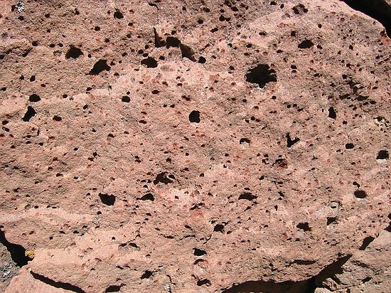 Holes are where hematite (secondary) has weathered out of the Fountain sandstones.