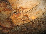 Formations in the cave's "big room" - ceiling.  Note soda straw formations.