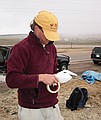 Rich Barclay wraps fossils as the weather gets colder.  The snow flakes are beginning to fall...  (4/23/03)